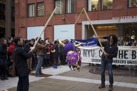 NYU4OWS, Wally, November 17, 2011. “The Spirit of Occupy Wall Street at NYU” bull piñata performance, New York (Stern School of Business, New York University). Courtesy Daniel Aldana Cohen.