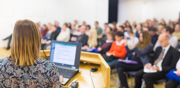 Women presenting conference.