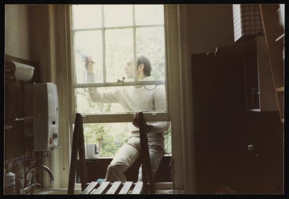 Marie-Louise Von Motesiczky, Photograph of George Lewis painting a window frame, 1982